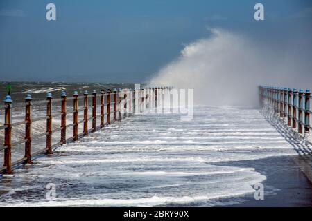 Morecambe, Lancashire, United Kingdom. 21st May, 2020. High onshore winds and a hig tide saw waves breaking over the Grosvenor Breakwater Credit: PN News/Alamy Live News Stock Photo