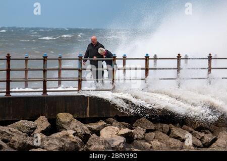 Morecambe, Lancashire, United Kingdom. 21st May, 2020. High onshore winds and a hig tide saw waves breaking over the Grosvenor Breakwater Credit: PN News/Alamy Live News Stock Photo