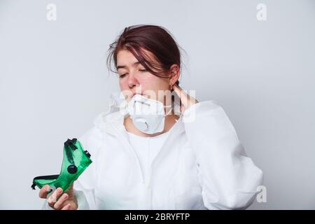 Doctor Is Taking Off Ppe - Costume, Gloves And Respirator Mask. Concept 