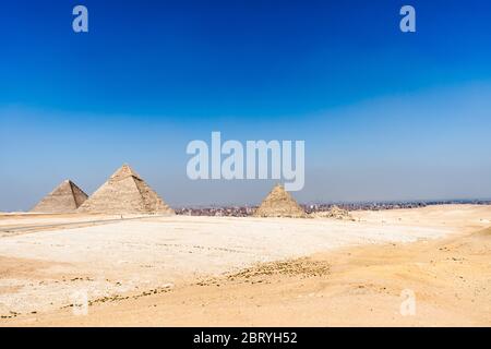 Egypt. Cairo - Giza. General view of pyramids from the Giza Plateau (from left: the Pyramid of Chufu /Cheops/, Khafre, Menkaure /Mykerinos/ and one of Stock Photo