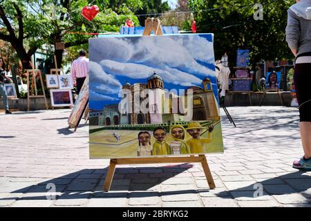 Painting on display in central square of Oaxaca, being sold by artist Stock Photo