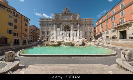 Rome, Italy -19 May 2020: The popular tourist landmark Trevi Fountain is empty following the tourism collapse in Italy after confinement and travel ba Stock Photo