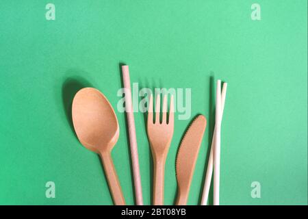 Eco friendly kitchenware on the green background. Zero waste, plastic free concept. Sustainable lifestyle. Flat lay, top view. Stock Photo