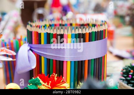Colored pencils arranged in a row and in a circle . close up of colorful set wooden color pencil in isolated black and blur background.Colorful Stock Photo