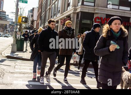 Pedestrians cross an intersection in the Chelsea neighborhood of New York on Saturday, February 29, 2020.  (© Richard B. Levine) Stock Photo