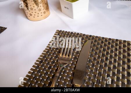 Cutlery lies on a surface in a restaurant Stock Photo