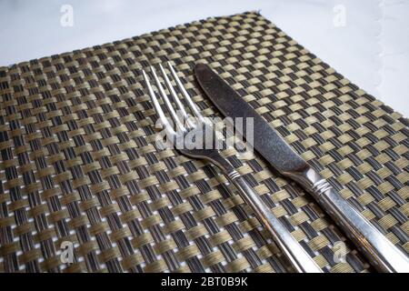Cutlery lies on a surface in a restaurant Stock Photo