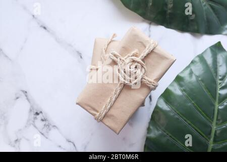 Handmade crafted paper gift boxes on wooden background  Stock Photo