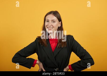Happy Female Smiling With Hands On Her Belt. Kind, Sincere People Stock Photo