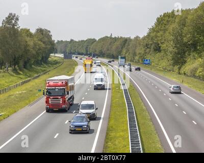 Motor Traffic on the A1 Motorway seen from above. This is one of the Bussiest highways in the Netherlands Stock Photo