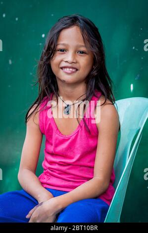 A pretty young Filipino girl poses for the camera in Ermita, Manila