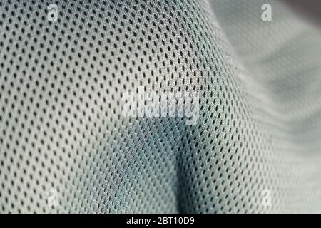 Macro shot of a mesh-like undulating gray silver surface Stock Photo
