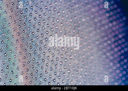 Macro shot of a pointy, wavy, colorful surface made up of small flashes Stock Photo