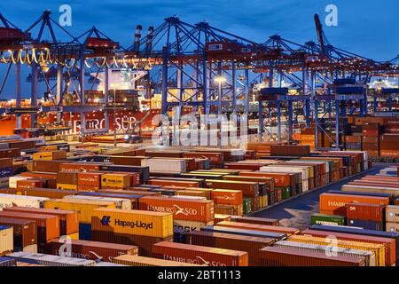 Busy work on the huge Container Terminal Burchardkai in the port of  Hamburg. Stock Photo