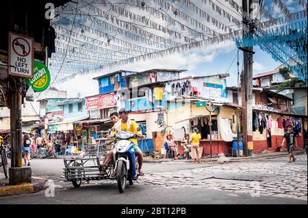 Shots of a colourful and busy road junction in the old walled city of Intramurous, Manila, The Philippines. Stock Photo