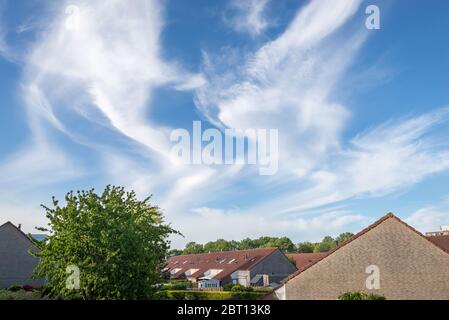 Twisted Cirrus clouds high up in the sky. Latin name is Cirrus intortus. Stock Photo