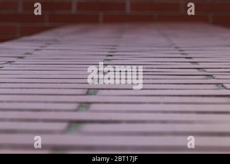 detailed close up view on red brick wall at aged and weathered building. Stock Photo