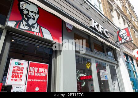 LONDON- MAY, 2020: A KFC store in the City of London with sign indicating that its now open for Take Away following the closures due to Covid 19 Stock Photo