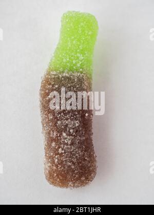 Cola bottle jelly candy macro on white background Stock Photo