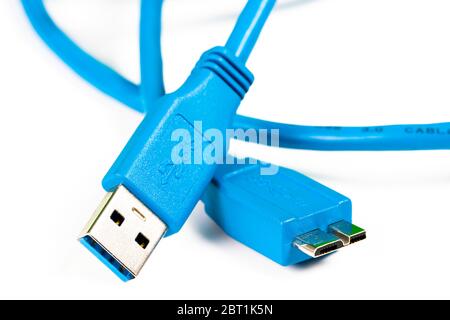 Blue usb 3.0 cable with micro B connector isolated on white background. Macro image. Stock Photo