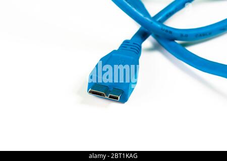 Blue micro B connector isolated on white background. Macro image. Stock Photo