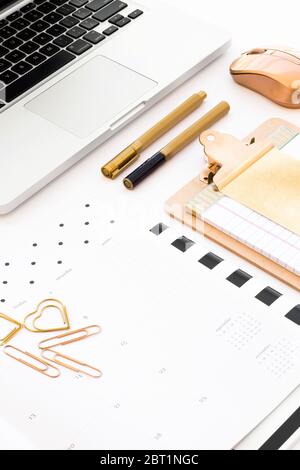 Gold office accessories details in a white desk Stock Photo