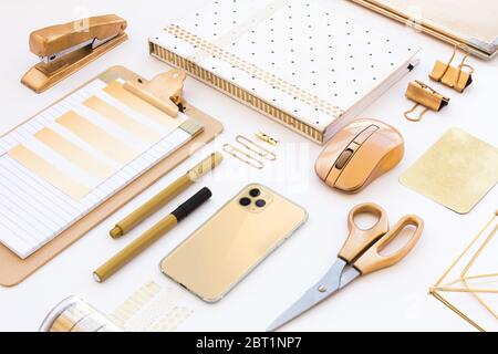 Gold office accessories details in a white desk Stock Photo