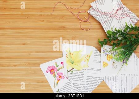 Mini paper envelopes in a woody background Stock Photo