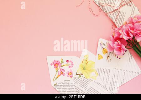 Mini paper envelopes in a rosy background Stock Photo