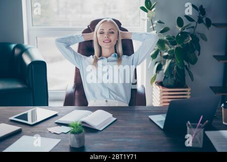 Portrait of her she nice attractive lovely cheery dreamy professional girl hr manager leading expert experienced financier insurance director sitting Stock Photo
