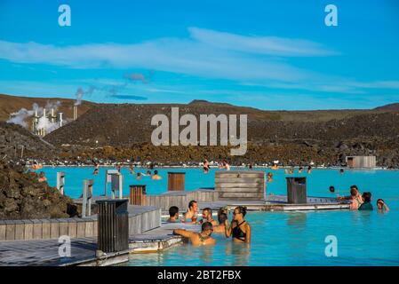 people at geothermal warm pool Blue Lagoon in Iceland Stock Photo