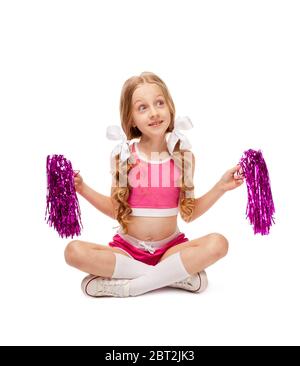 girl in a cheerleader costume with a pom poms on a white Stock Photo