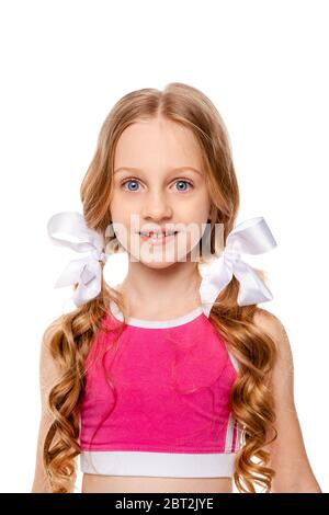 long-haired girl in a pink tank top smiles Stock Photo