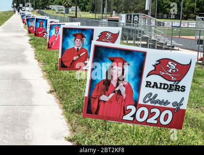 2020 graduating class of Seniors at Santa Fe High School in Alachua, Florida, have their graduation pictures posted alongside Highway 441 in Alachua, Stock Photo