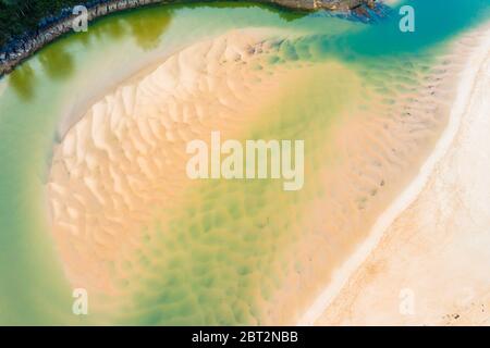 Sandy sediments in low tide in a river close to the sea. Stock Photo