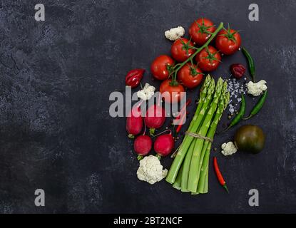 Fresh raw vegetables on black background.  Stock Photo