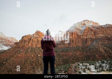 Rear view of woman looking at view, Zion National Park, Utah, USA Stock Photo