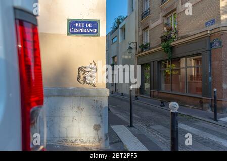 Paris, France - May 17, 2020: Parisian street signs and a graffiti, taken at the end of the day, Butte-aux-Cailles Stock Photo