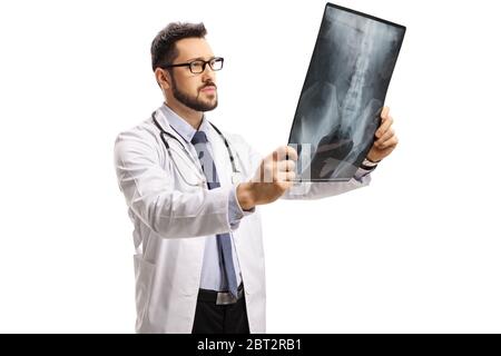 Young male doctor examining an x ray scan isolated on white background Stock Photo