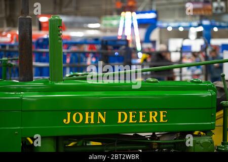Harrisburg, PA / USA - January 9, 2020: An antique John Deere Tractor is on display at the Pennsylvania Farm Show. Stock Photo