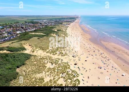 worlds most beautiful beaches, camber sands on a beautiful sunny day packed with beach lovers Stock Photo