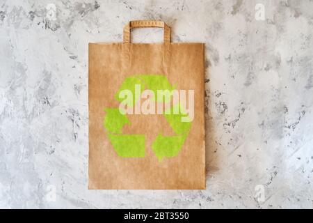 Blank eco brown paper bag on light background. Craft grocery bag. Mockup. Copy space Stock Photo