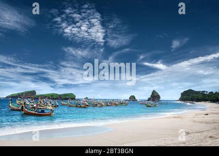 Traditional boats anchored at sea, Papuma Beach, Jember, East Java, Indonesia Stock Photo
