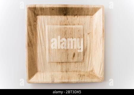 Square shaped palm leaf plate isolated on white background Stock Photo
