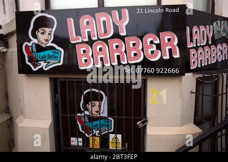 Peterborough, UK. 22nd May, 2020. Day Sixty of Lockdown, in Peterborough. The Lady Barber shop remains closed. Even though there has been a partial lifting of lockdown, there are still many shops that have to remain closed, including barbers and hairdresser salons. COVID-19 Coronavirus lockdown, Peterborough, Cambridgeshire, UK, on May 22, 2020 Credit: Paul Marriott/Alamy Live News Stock Photo