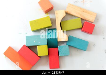 Wooden blocks in multi-color laid flat on a table Stock Photo