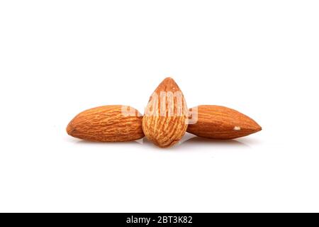 Close Up of organic almonds, isolated on the white background Stock Photo
