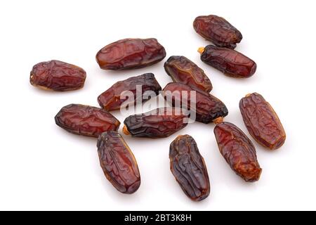 Organic and Fresh Medjool dried Dates, close-up, isolated on white background. Stock Photo