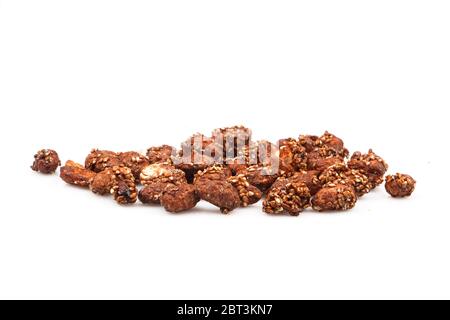 Organic sauce covered peanuts on white background Stock Photo