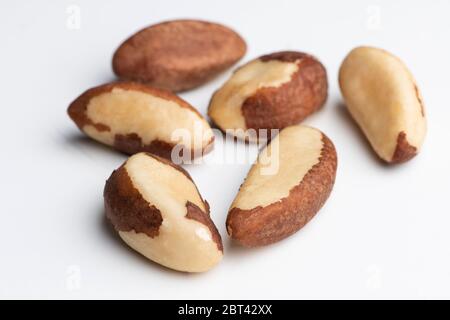 Many fresh and tasty Brazilian nuts on a white background Stock Photo